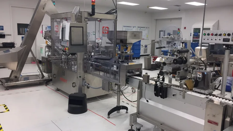 Automated cartoning and labeling line in a medical device cleanroom