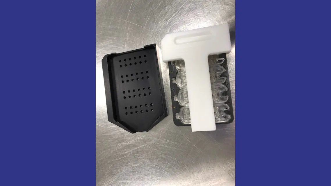 Component nests and fixtures holding molded medical device parts for assembly