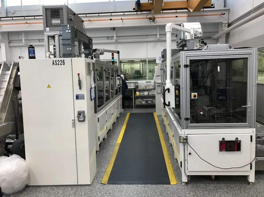Automated medical device assembly machine running at eighty parts per minute