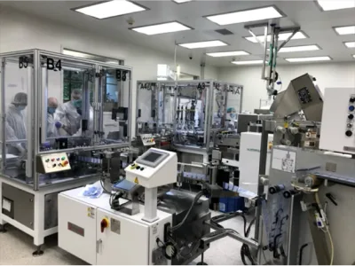 High-speed filling machine running containers on a medical device production line