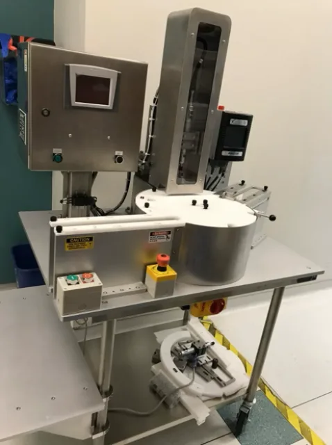 Portable multi-cap and bottle torque station with rotary cap feeder and operator HMI, built to a written specification