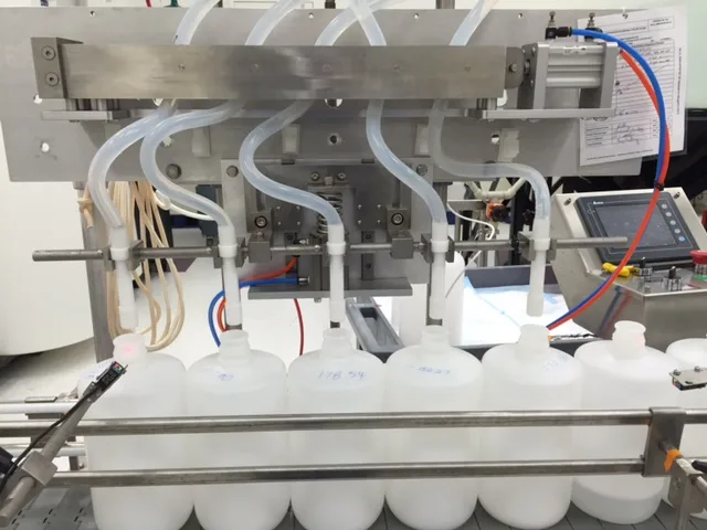 Five-channel pinch valve filling head dispensing into plastic bottles